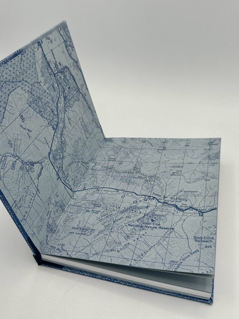 Blue end page showcasing a dark blue riso-print style OS Map of Glencoe.