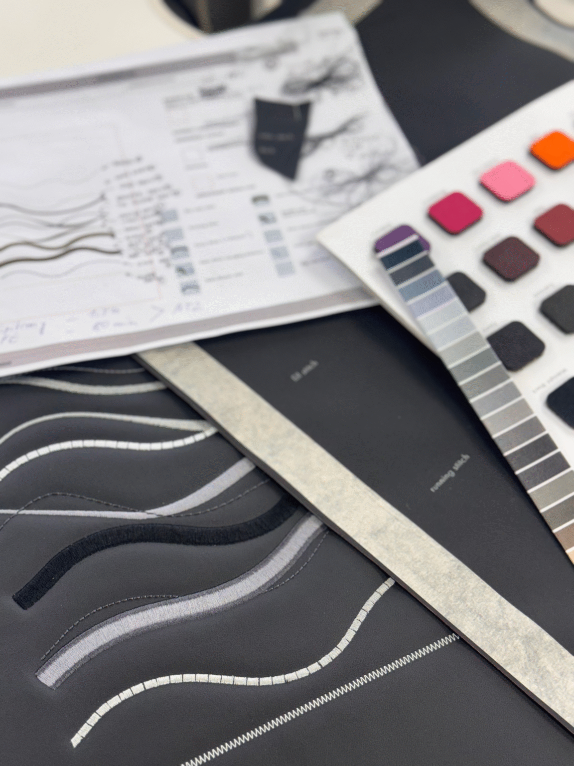 Colour core sample demonstrating a range of automotive stitching types, with laser etching used to label each stitch. The piece highlights the process of colour analysis and material selection, showcasing how design decisions translate into refined, industry-standard CMF applications.